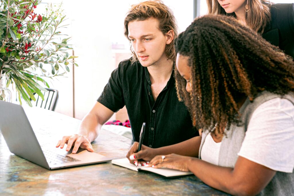 Two colleagues collaborating in a sales and marketing training.